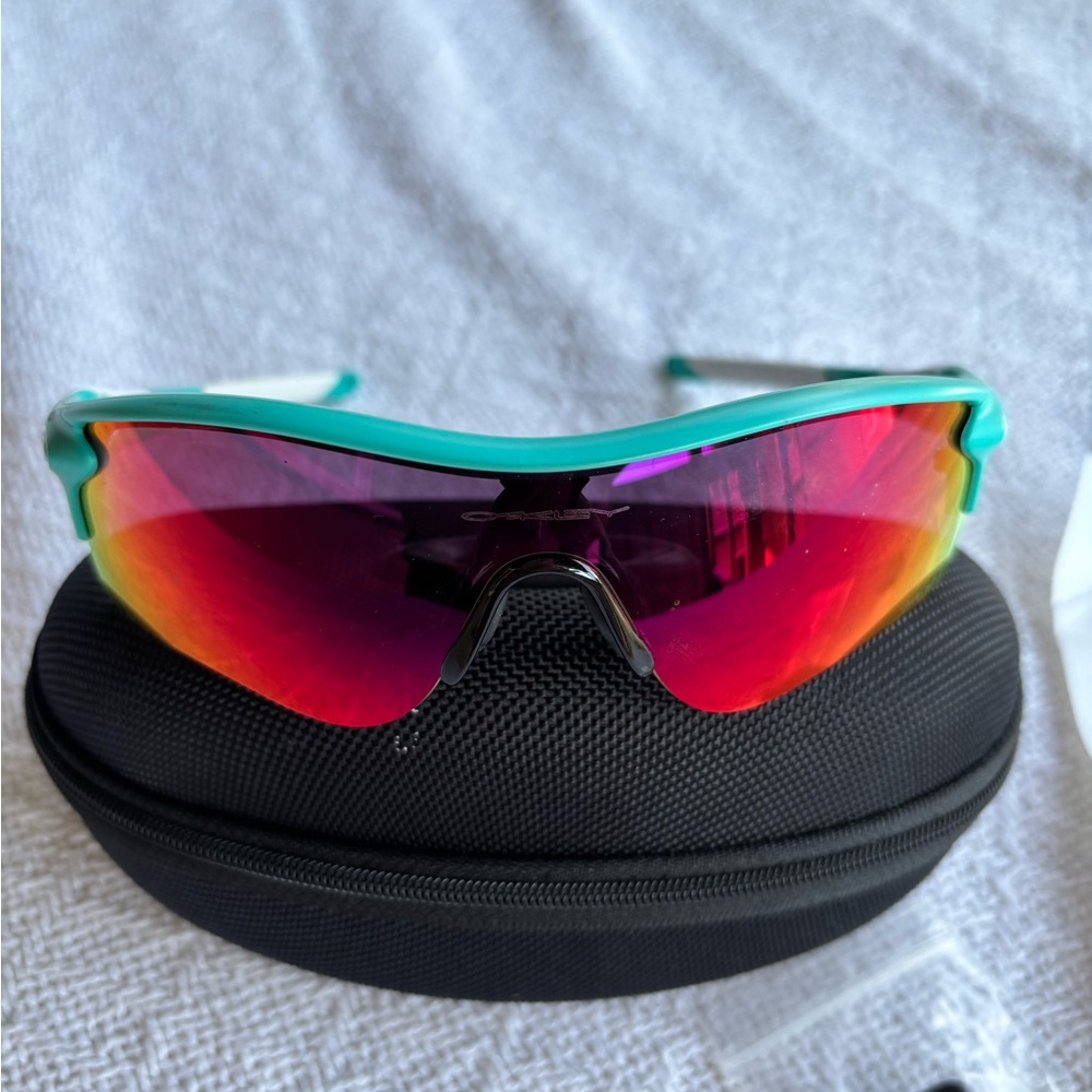 Oakley Teal Frame Sunglasses with Red Lenses